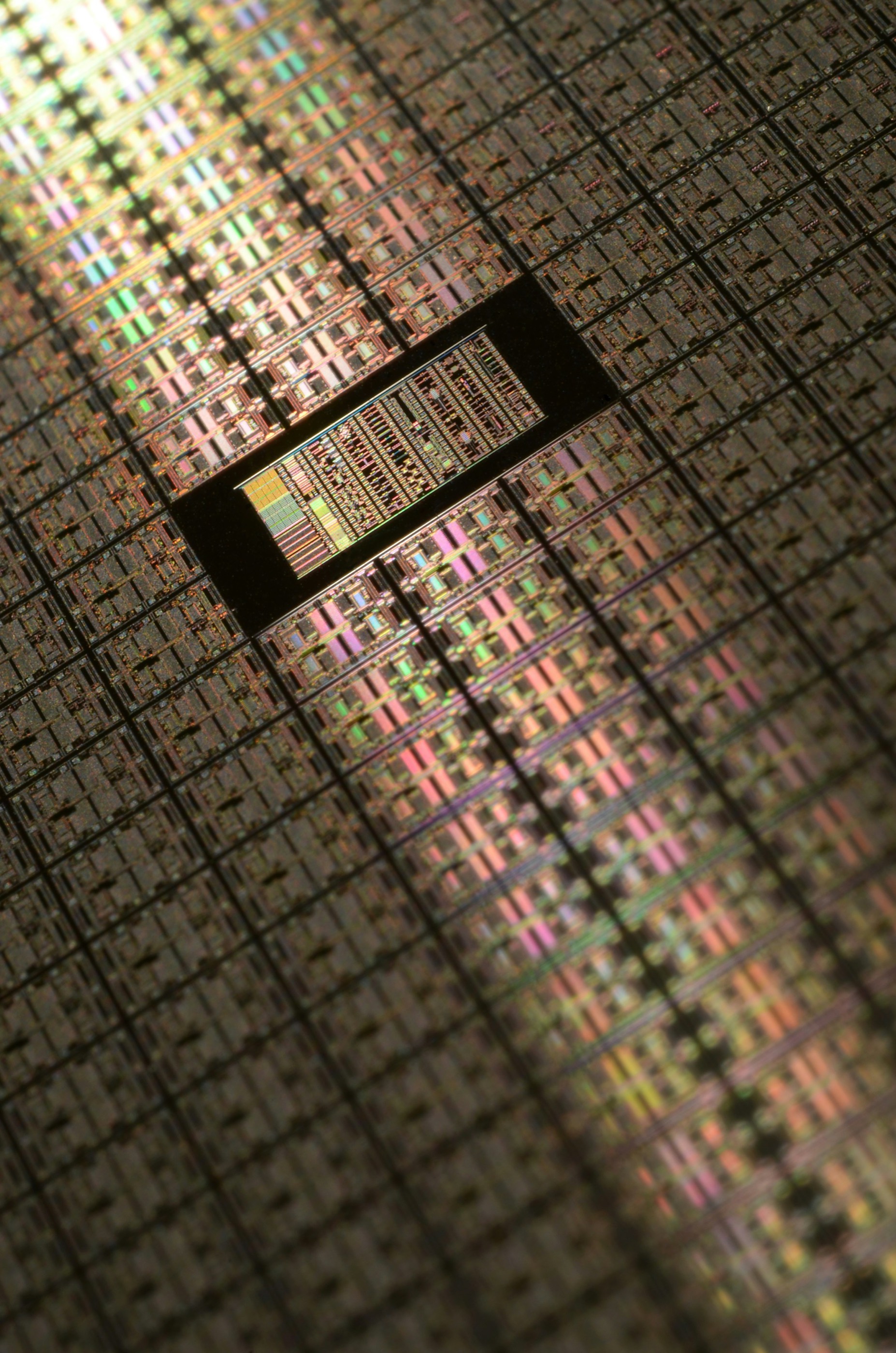 Macro view of patterned dies across a silicon wafer